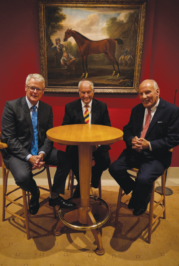 Mike Cattermole, Bob Champion and Sir Mark Prescott at a recent fundraising event in Newmarket.